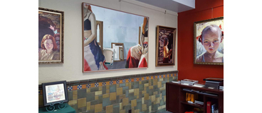 art gallery wall with paintings